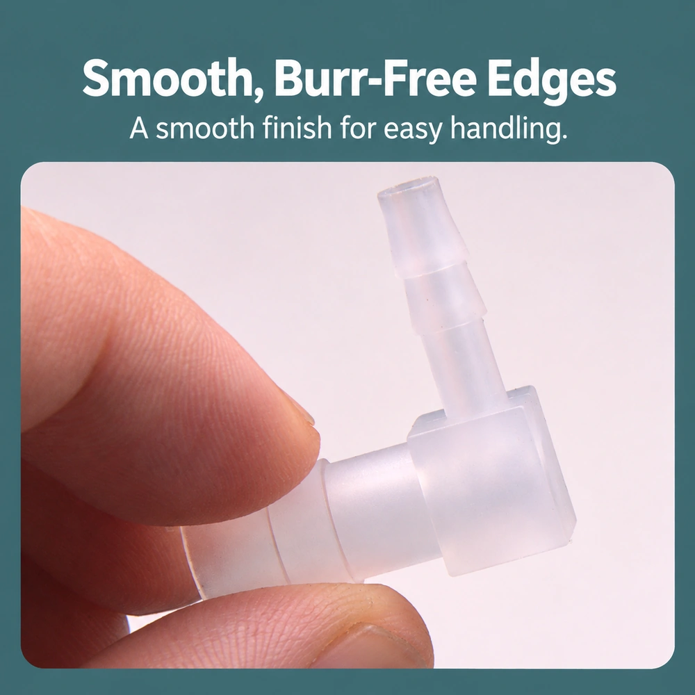 PP barbed elbow connector close-up highlighting the smooth edges and hose barb surfaces.