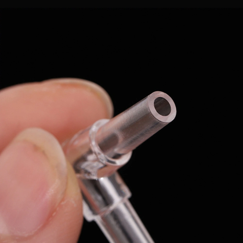 Aquarium airline elbow connector close-up showing the circular opening and tube wall at one end.