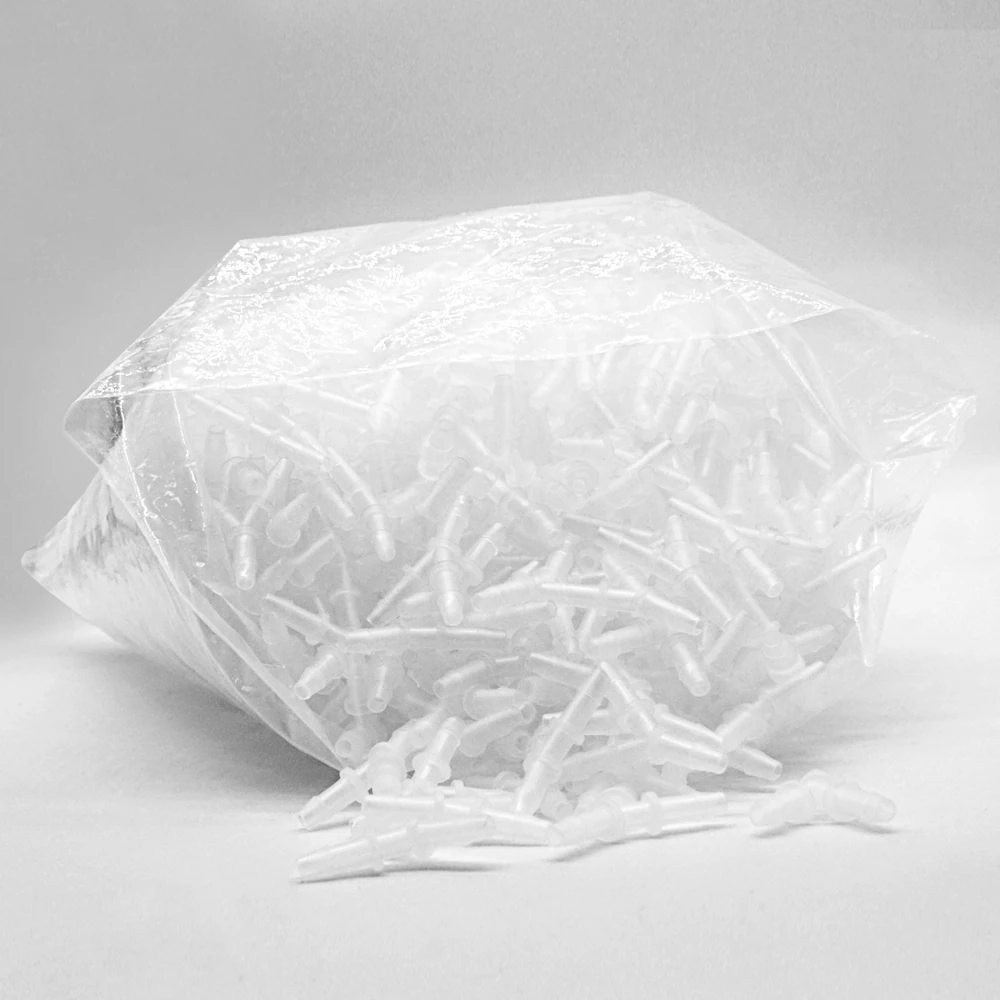 Translucent aquarium airline Y connectors in an open clear bag, with loose fittings in front.