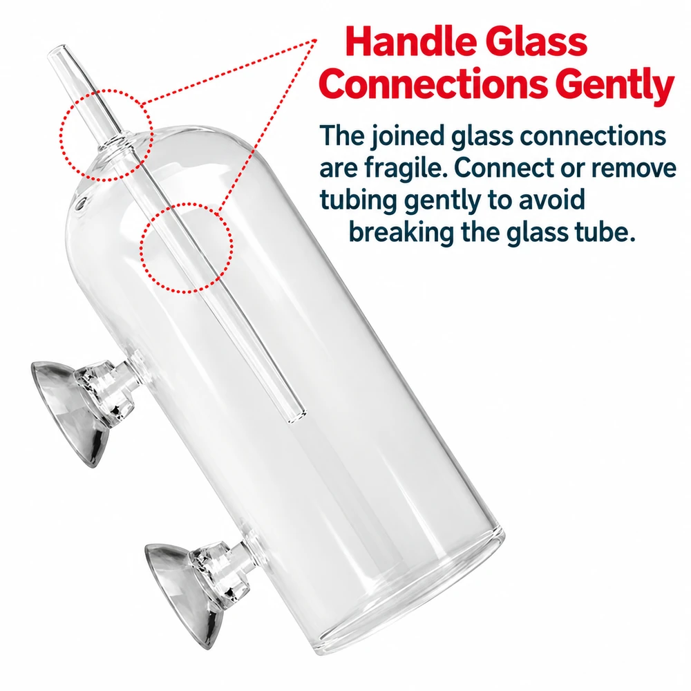 Glass aquarium air stone splash guard with fragile inlet and inner tube connections that require gentle tubing attachment and removal.
