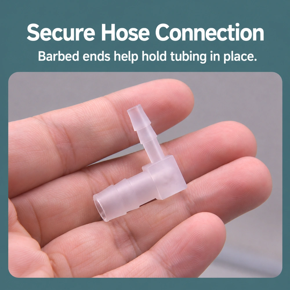 PP barbed elbow connector resting on fingers, showing the open hose end, retaining barbs and 90° bend.