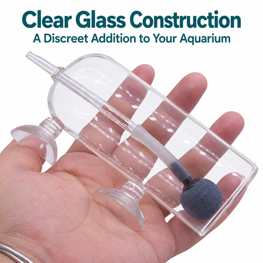 Glass aquarium air stone splash guard resting on a hand, with two suction cups, an internal glass tube and a connected air stone.