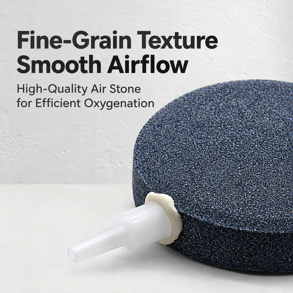 Aquarium air stone disc close-up showing its fine-grain surface and white stepped air inlet.