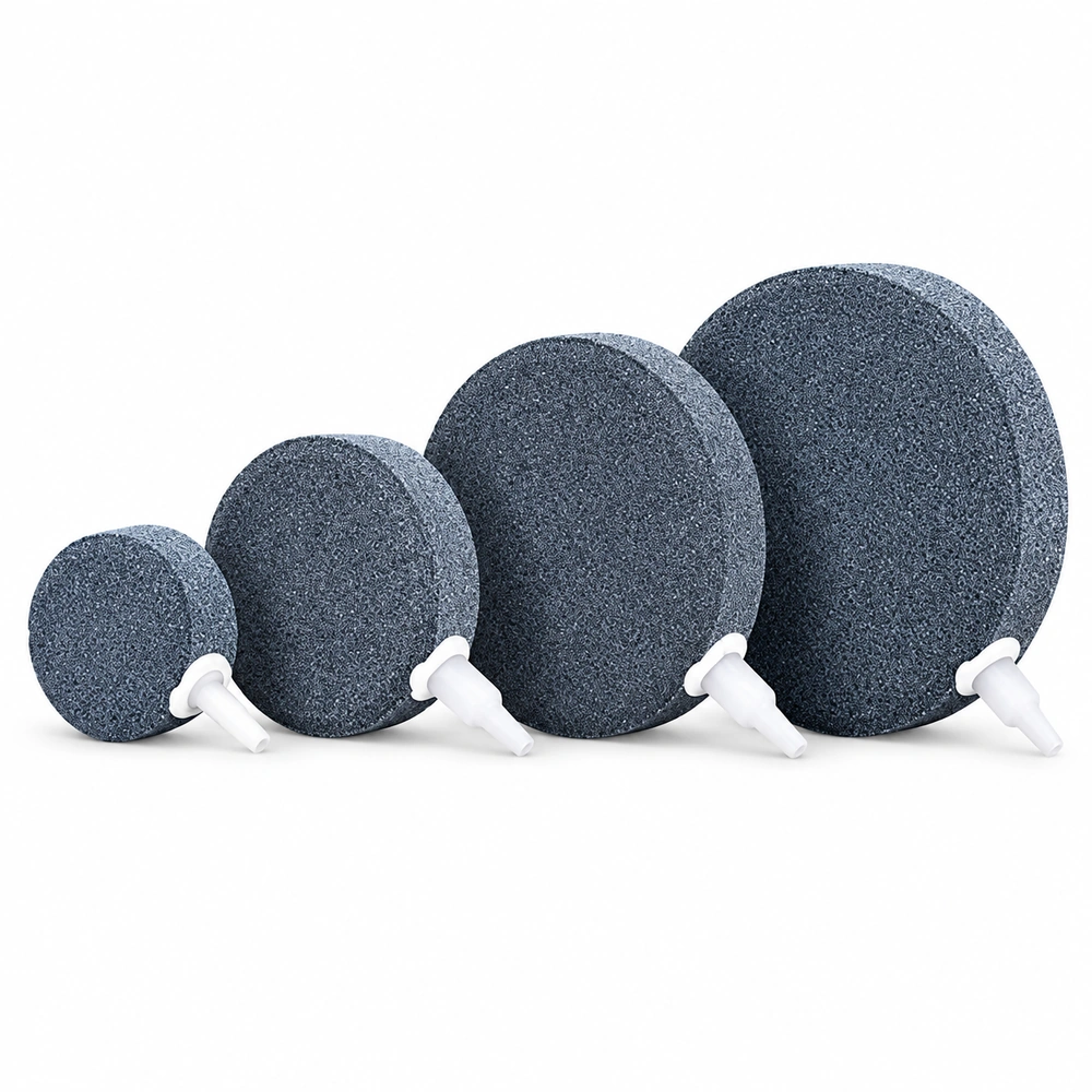 KOOI aquarium air stone discs in four sizes, arranged from smallest to largest with white air inlets.